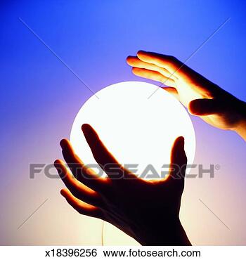 Stock Photo - close-up of man's 
hands touching 
crystal ball. 
fotosearch - search 
stock photos, 
pictures, images, 
and photo clipart