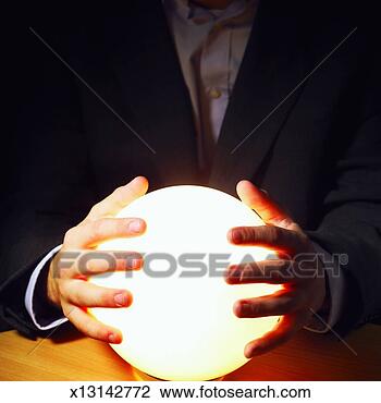 Stock Photo - close-up mid section 
of man touching 
crystal ball. 
fotosearch - search 
stock photos, 
pictures, images, 
and photo clipart