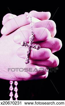 Stock Photography - close-up of a 
woman's hands 
praying with rosary 
beads. fotosearch 
- search stock 
photos, pictures, 
images, and photo 
clipart