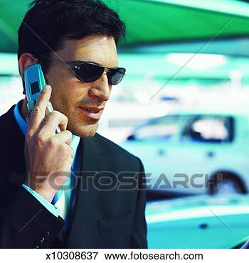Picture - close-up of businessman 
talking on mobile 
phone. fotosearch 
- search stock 
photos, pictures, 
images, and photo 
clipart
