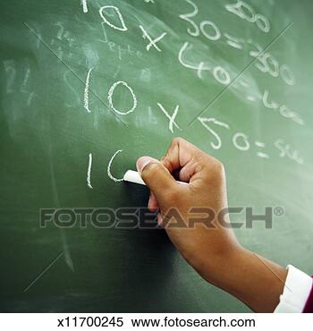 Stock Image - close-up of boy's 
hand writing mathematics 
on chalkboard 
(11-12). fotosearch 
- search stock 
photos, pictures, 
images, and photo 
clipart