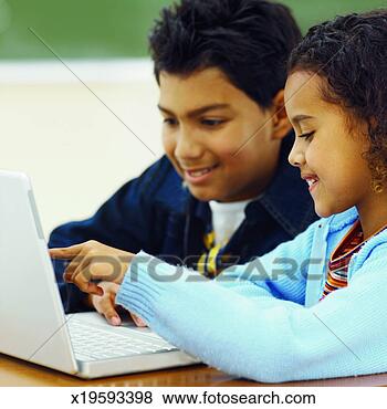 Stock Photo - close-up of two 
pupils working 
on computer in 
classroom (9-11). 
fotosearch - search 
stock photos, 
pictures, images, 
and photo clipart