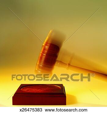Stock Photo - close-up of gavel 
hitting pad (blurred). 
fotosearch - search 
stock photos, 
pictures, images, 
and photo clipart