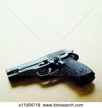 Stock Photo - close-up of a 
gun. fotosearch 
- search stock 
photos, pictures, 
images, and photo 
clipart