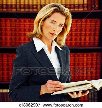Picture - front view portrait 
of female lawyer 
holding law book. 
fotosearch - search 
stock photos, 
pictures, images, 
and photo clipart