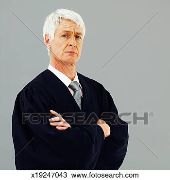 Stock Photo - front view portrait 
of male judge 
with arms crossed. 
fotosearch - search 
stock photos, 
pictures, images, 
and photo clipart