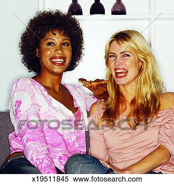 Stock Image - front view of 
two women eating 
slice of pizza. 
fotosearch - search 
stock photos, 
pictures, images, 
and photo clipart