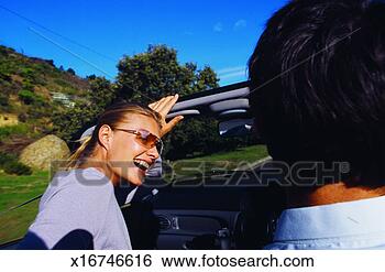Stock Photo - close-up of young 
couple traveling 
in convertible 
car. fotosearch 
- search stock 
photos, pictures, 
images, and photo 
clipart