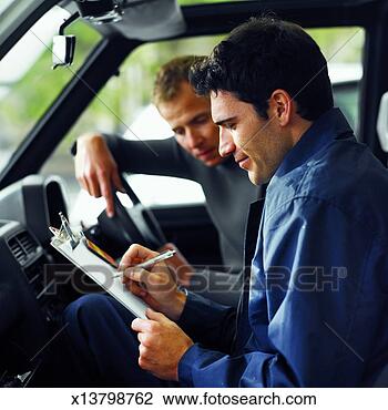Stock Photo - side view of instructor 
showing man test 
results. fotosearch 
- search stock 
photos, pictures, 
images, and photo 
clipart