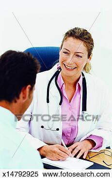 Stock Image - close-up of doctor 
writing personal 
details in file 
about patient. 
fotosearch - search 
stock photos, 
pictures, images, 
and photo clipart