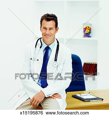 Stock Photo - front view portrait 
of doctor sitting 
on desk. fotosearch 
- search stock 
photos, pictures, 
images, and photo 
clipart
