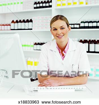 Stock Photo - front view portrait 
of pharmacist 
standing at counter. 
fotosearch - search 
stock photos, 
pictures, images, 
and photo clipart