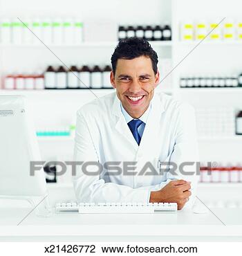 Stock Photo - front view portrait 
of pharmacist 
standing at counter. 
fotosearch - search 
stock photos, 
pictures, images, 
and photo clipart