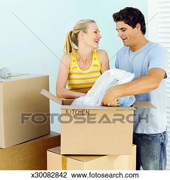 Stock Photo - couple moving 
house. fotosearch 
- search stock 
photos, pictures, 
images, and photo 
clipart