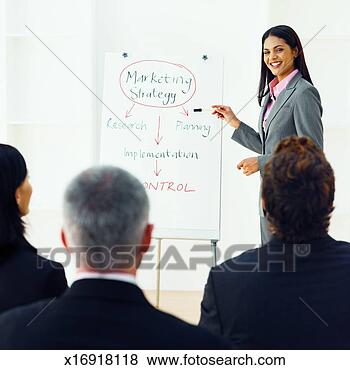 Stock Photo - businesswoman 
giving presentation 
to three business 
executives. fotosearch 
- search stock 
photos, pictures, 
images, and photo 
clipart