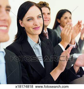 Stock Photo - close-up of four 
business executives 
applauding. fotosearch 
- search stock 
photos, pictures, 
images, and photo 
clipart