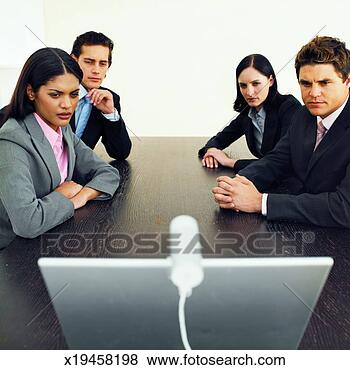 Stock Photo - close-up of four 
business executives 
having video conference. 
fotosearch - search 
stock photos, 
pictures, images, 
and photo clipart