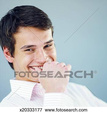 Picture - close-up portrait 
of young man smiling. 
fotosearch - search 
stock photos, 
pictures, images, 
and photo clipart