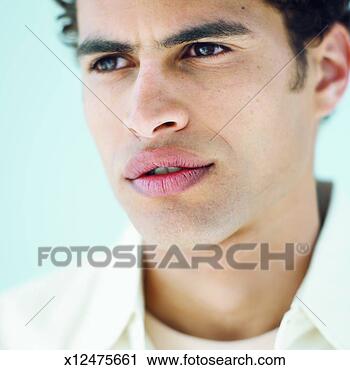 Stock Photography - front view portrait 
of young man. 
fotosearch - search 
stock photos, 
pictures, images, 
and photo clipart