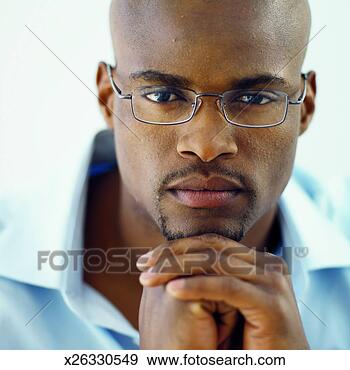 Stock Photograph - front view portrait 
of young man wearing 
glasses. fotosearch 
- search stock 
photos, pictures, 
images, and photo 
clipart