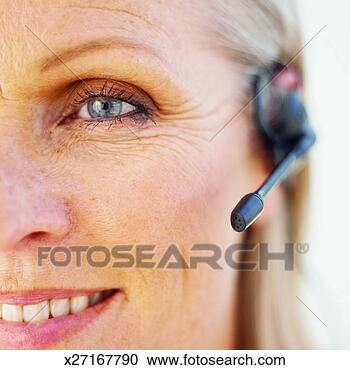 Stock Photography - close-up of businesswoman 
wearing headset. 
fotosearch - search 
stock photos, 
pictures, images, 
and photo clipart