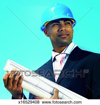 Stock Photo - front view portrait 
of businessman 
wearing hard hat 
and holding. fotosearch 
- search stock 
photos, pictures, 
images, and photo 
clipart