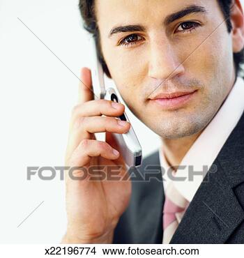Stock Photo - front view portrait 
of businessman 
talking on mobile 
phone. fotosearch 
- search stock 
photos, pictures, 
images, and photo 
clipart