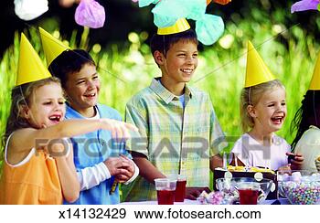 Stock Photograph - children at a 
birthday party. 
fotosearch - search 
stock photos, 
pictures, images, 
and photo clipart