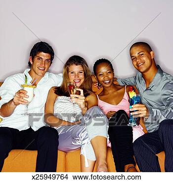 Stock Photo - front view portrait 
of four young 
people holding 
cocktails. fotosearch 
- search stock 
photos, pictures, 
images, and photo 
clipart
