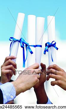 Stock Image - close-up of the 
hands of four 
young people holding 
certificates. 
fotosearch - search 
stock photos, 
pictures, images, 
and photo clipart