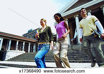 Stock Photography - three young people 
walking outside 
college. fotosearch 
- search stock 
photos, pictures, 
images, and photo 
clipart