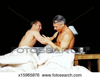 Stock Photo - a gay couple playing 
in bed together. 
fotosearch - search 
stock photos, 
pictures, images, 
and photo clipart