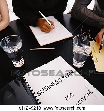 Stock Photo - high angle view 
of a team of business 
executives discussing 
a. fotosearch 
- search stock 
photos, pictures, 
images, and photo 
clipart