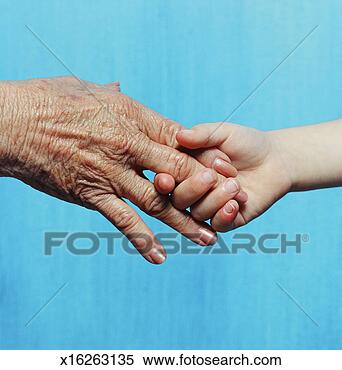 Stock Image - a young person 
and elderly person 
shaking hands. 
fotosearch - search 
stock photos, 
pictures, images, 
and photo clipart