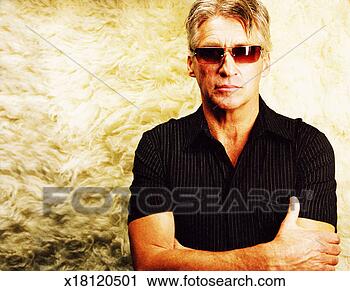 Stock Photography - portrait of a 
gray haired man 
wearing sunglasses 
with arms folded. 
fotosearch - search 
stock photos, 
pictures, images, 
and photo clipart