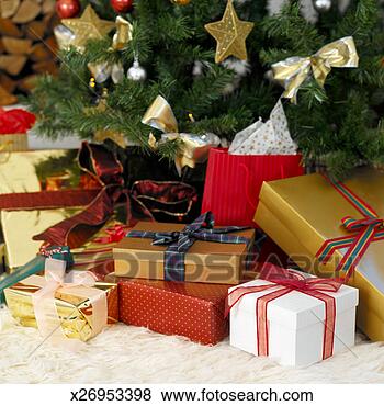 Stock Photo - close-up of a 
christmas tree 
with christmas 
presents. fotosearch 
- search stock 
photos, pictures, 
images, and photo 
clipart