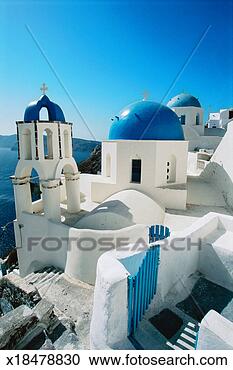 Stock Photography - blue domes in 
the village of 
oia santorini, 
the cyclades, 
greece. fotosearch 
- search stock 
photos, pictures, 
images, and photo 
clipart