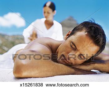 Stock Photo - close-up of a 
mid adult man 
getting a massage 
from a massage 
therapist. fotosearch 
- search stock 
photos, pictures, 
images, and photo 
clipart