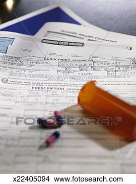 Stock Photo - bottle of pills 
and insurance 
forms. fotosearch 
- search stock 
photos, pictures, 
images, and photo 
clipart