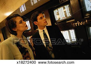 Stock Photography - passengers checking 
flight information. 
fotosearch - search 
stock photos, 
pictures, images, 
and photo clipart
