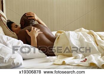 Stock Photo - couple kissing 
on bed. fotosearch 
- search stock 
photos, pictures, 
images, and photo 
clipart