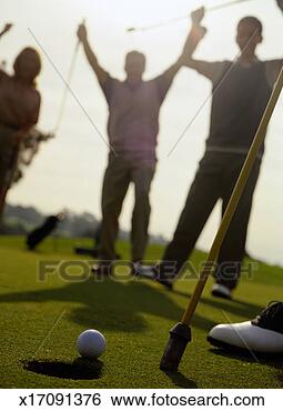 Stock Photo - golfers cheering 
at a golf ball. 
fotosearch - search 
stock photos, 
pictures, images, 
and photo clipart