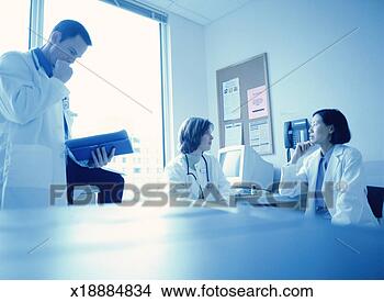 Stock Photo - three doctors 
in a doctor's 
office. fotosearch 
- search stock 
photos, pictures, 
images, and photo 
clipart