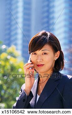 Clip Art - businesswoman 
using cellular 
phone. fotosearch 
- search clipart, 
illustration, 
drawings and vector 
eps graphics images