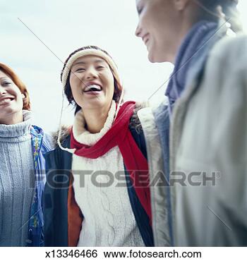 Stock Photo - young women in 
casual winter 
clothing, laughing. 
fotosearch - search 
stock photos, 
pictures, images, 
and photo clipart