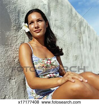 Stock Photo - young woman sitting. 
fotosearch - search 
stock photos, 
pictures, images, 
and photo clipart