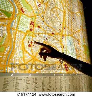 Stock Photo - hand pointing 
at map of madrid. 
fotosearch - search 
stock photos, 
pictures, images, 
and photo clipart