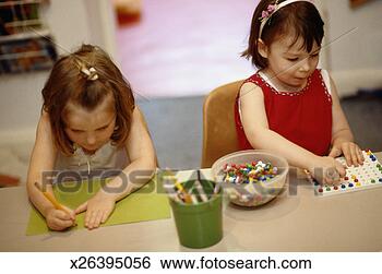 Stock Photo - young girls doing 
arts and crafts. 
fotosearch - search 
stock photos, 
pictures, images, 
and photo clipart