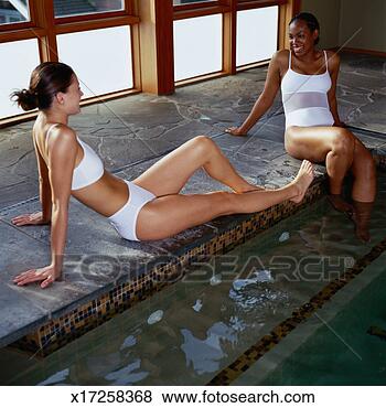 Stock Photo - two young women 
sitting by pool 
in health spa. 
fotosearch - search 
stock photos, 
pictures, images, 
and photo clipart