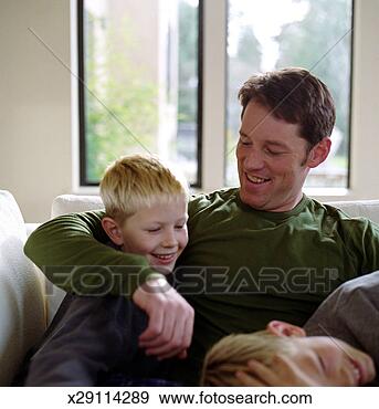 Stock Photograph - father rough housing 
with sons. fotosearch 
- search stock 
photos, pictures, 
images, and photo 
clipart